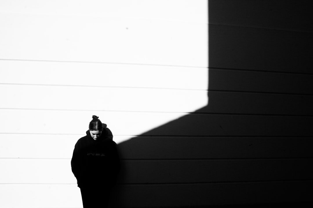 masked figure in shadow