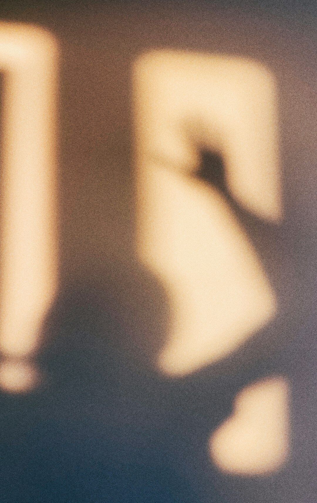 masked figure in shadow
