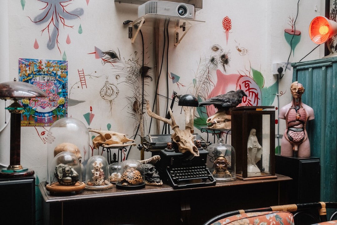 Vintage typewriter and magnifying glass on a wooden desk at night